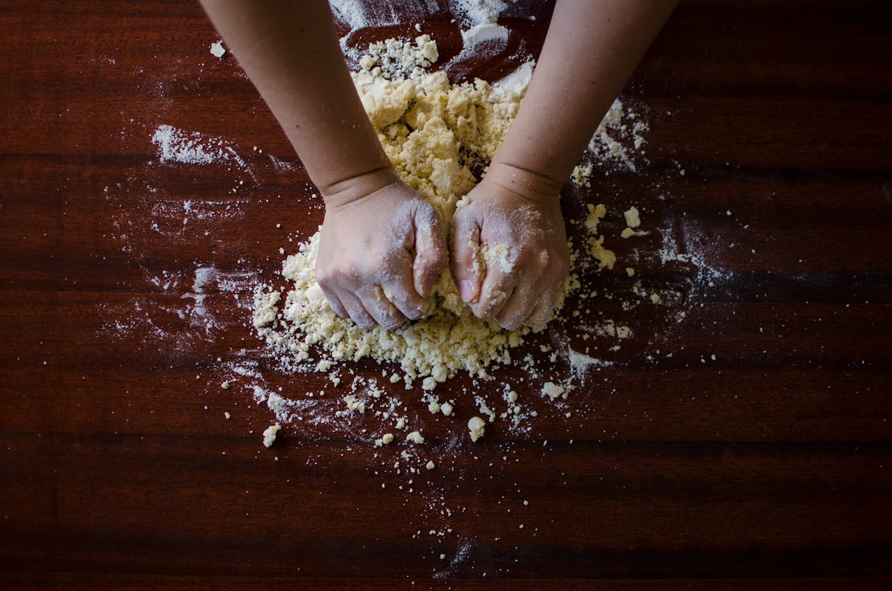 girl kneading flour